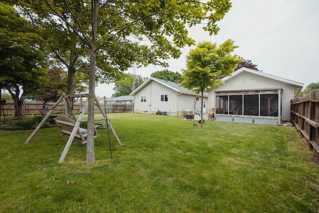 215 Marcoe St, Fond Du Lac, WI 54937 - fenced backyard featuring a sunroom