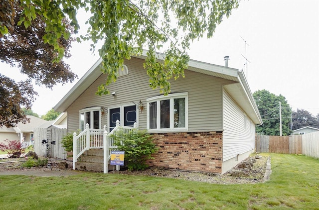 215 Marcoe St, Fond Du Lac, WI 54937 - view of front facade featuring brick siding