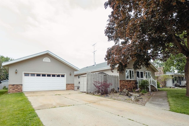 215 Marcoe St, Fond Du Lac, WI 54937 - ranch-style home with brick siding and a front yard
