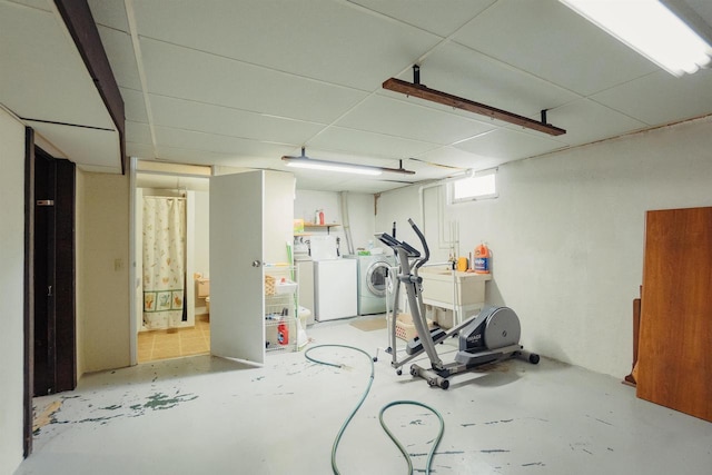 215 Marcoe St, Fond Du Lac, WI 54937 - workout room featuring washing machine and dryer and a drop ceiling
