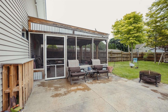 215 Marcoe St, Fond Du Lac, WI 54937 - view of patio / terrace featuring a sunroom and a fire pit