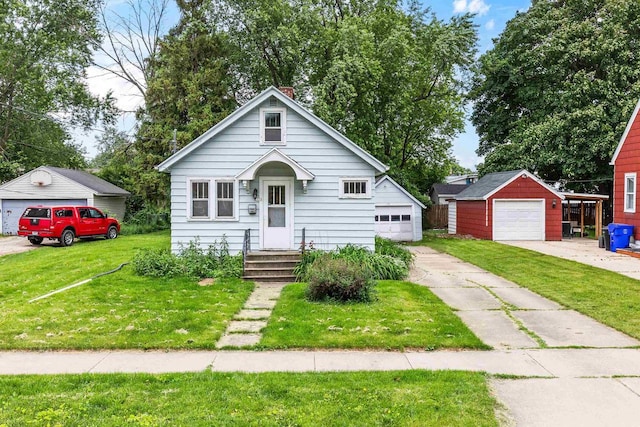 1513 W Washington St, Appleton, WI 54914 - bungalow-style house with an outbuilding, a front yard, and a garage