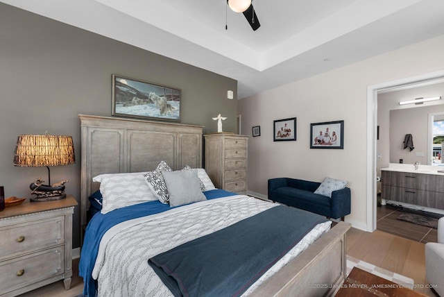 324 N Lake St Unit 204, Port Washington, WI 53074 - bedroom featuring ensuite bathroom, wood finished floors, and ceiling fan