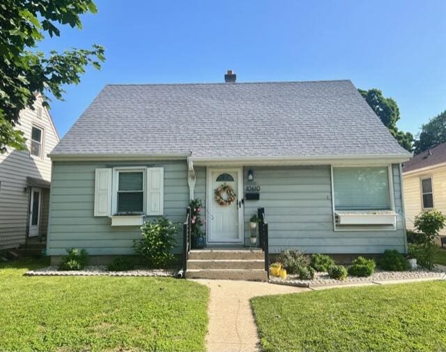 10610 W Rogers St, West Allis, WI 53227 - view of front of house with a front lawn