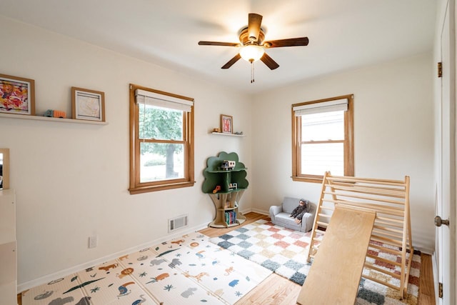 10610 W Rogers St, West Allis, WI 53227 - bedroom featuring wood finished floors and a ceiling fan