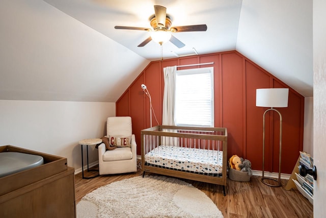 10610 W Rogers St, West Allis, WI 53227 - bedroom with vaulted ceiling, light wood-type flooring, ceiling fan, and a crib