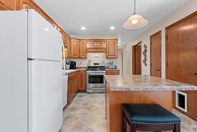 1899 Riverside Dr Unit A, Suamico, WI 54313 - kitchen with white appliances, a center island, recessed lighting, hanging light fixtures, and light countertops