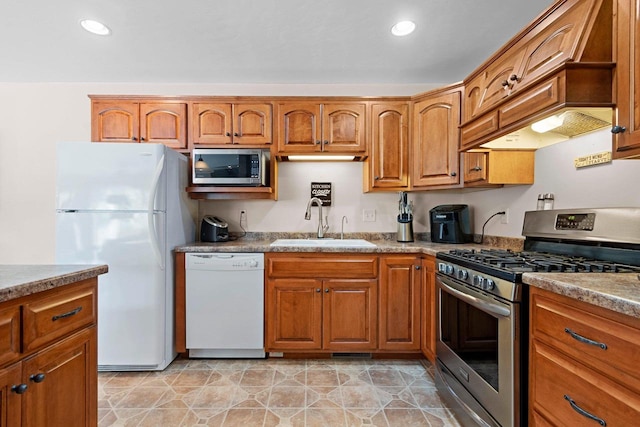 1899 Riverside Dr Unit A, Suamico, WI 54313 - kitchen featuring appliances with stainless steel finishes, brown cabinets, and recessed lighting