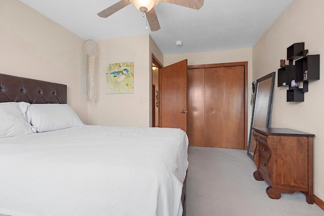 1899 Riverside Dr Unit A, Suamico, WI 54313 - bedroom featuring light carpet, a closet, and a ceiling fan