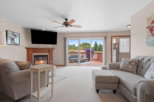 1899 Riverside Dr Unit A, Suamico, WI 54313 - living room featuring a ceiling fan, a glass covered fireplace, and light carpet