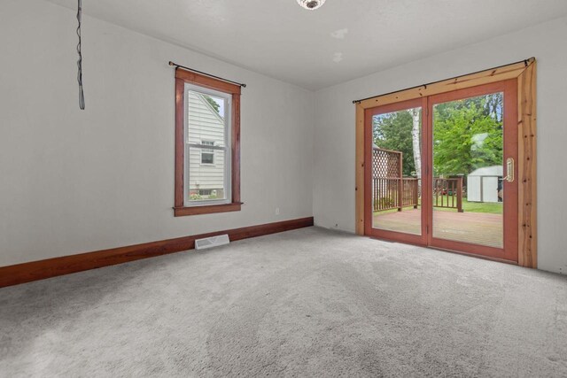 102 10th St, Clintonville, WI 54929 - carpeted spare room with baseboards