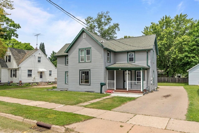 102 10th St, Clintonville, WI 54929 - view of front of house featuring covered porch, a shingled roof, and driveway