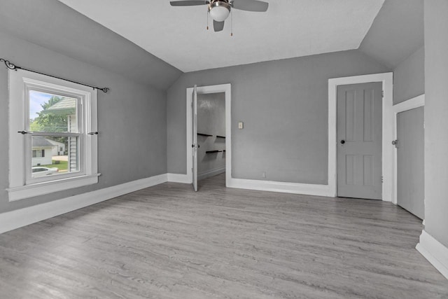 102 10th St, Clintonville, WI 54929 - unfurnished room with vaulted ceiling, a ceiling fan, and wood finished floors