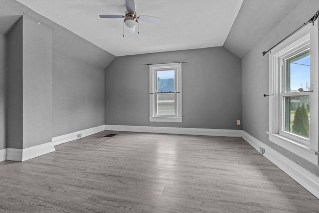 102 10th St, Clintonville, WI 54929 - bonus room with vaulted ceiling, wood finished floors, and ceiling fan