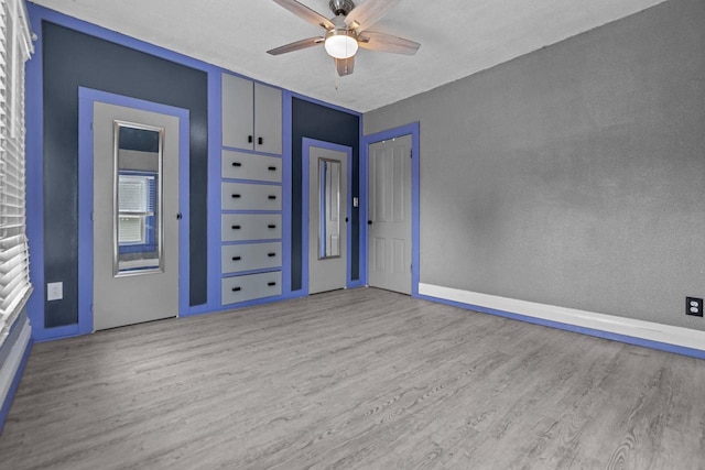 102 10th St, Clintonville, WI 54929 - empty room featuring wood finished floors and a ceiling fan