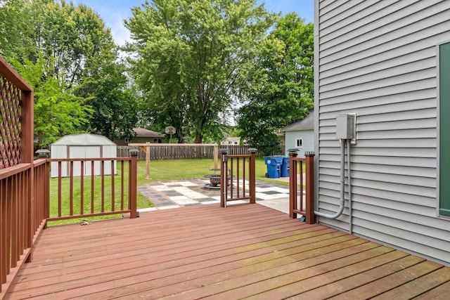 102 10th St, Clintonville, WI 54929 - wooden deck featuring a fenced backyard, a shed, and a patio area