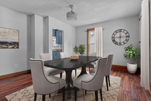 102 10th St, Clintonville, WI 54929 - dining room with dark wood-type flooring and a textured ceiling