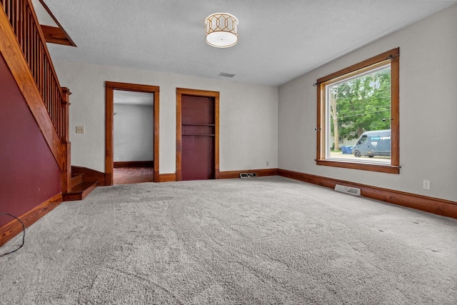 102 10th St, Clintonville, WI 54929 - unfurnished bedroom with carpet and a textured ceiling