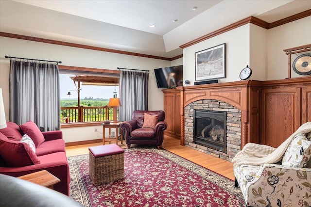 S3358 Hass Ln, Viroqua, WI 54618 - living room featuring light wood-style floors, a stone fireplace, and ornamental molding