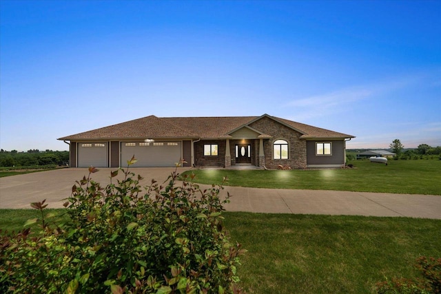 S3358 Hass Ln, Viroqua, WI 54618 - ranch-style home featuring an attached garage, driveway, and a front lawn