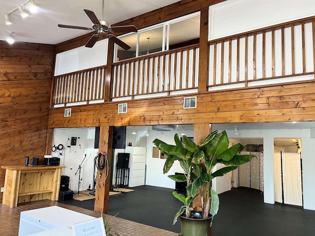 2400 Church St, Stevens Point, WI 54481 - interior space featuring a ceiling fan, wooden walls, and rail lighting