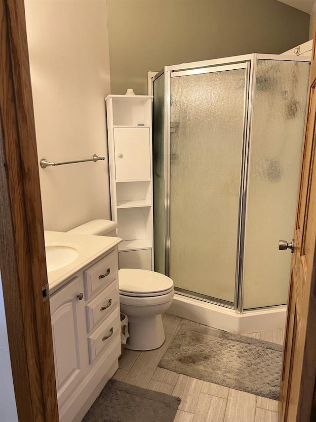 2400 Church St, Stevens Point, WI 54481 - full bathroom featuring a stall shower and wood finished floors