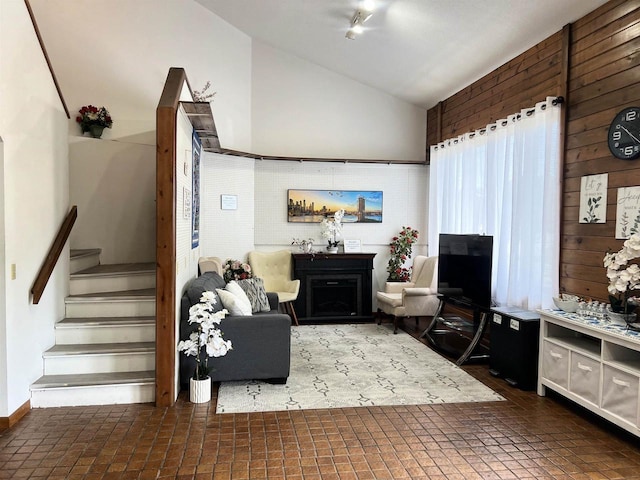 2400 Church St, Stevens Point, WI 54481 - living room with lofted ceiling, stairs, and a fireplace