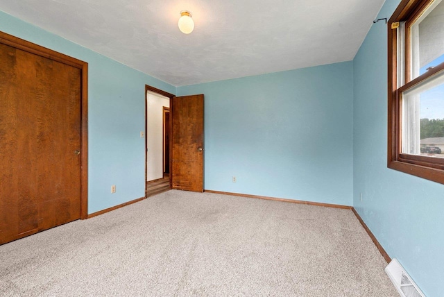 1517 Navarino St, Algoma, WI 54201 - unfurnished bedroom featuring carpet and a closet