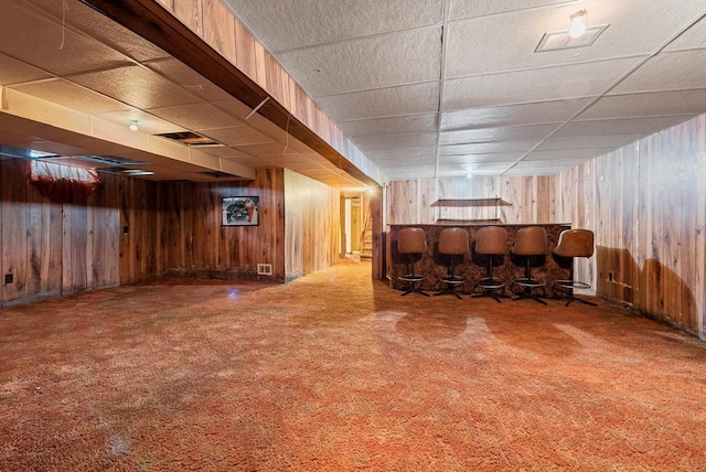 1517 Navarino St, Algoma, WI 54201 - finished basement with wooden walls, a paneled ceiling, carpet flooring, and a dry bar