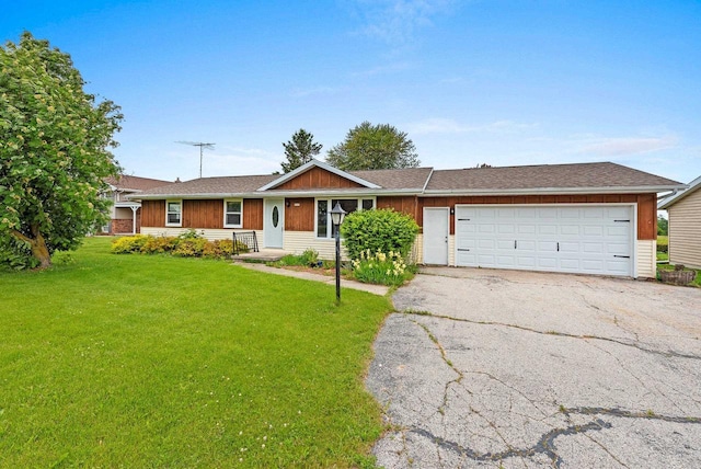 1517 Navarino St, Algoma, WI 54201 - single story home with asphalt driveway, a front lawn, and an attached garage