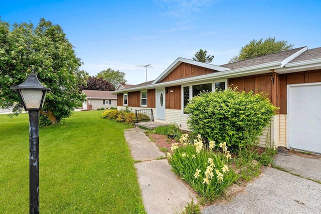 1517 Navarino St, Algoma, WI 54201 - view of front of house featuring a front yard and board and batten siding