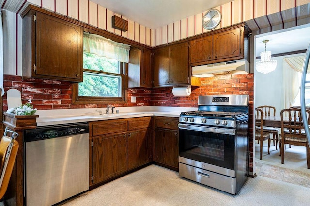 9600 W Debbie Ln, Milwaukee, WI 53224 - kitchen with appliances with stainless steel finishes, under cabinet range hood, light countertops, and a chandelier