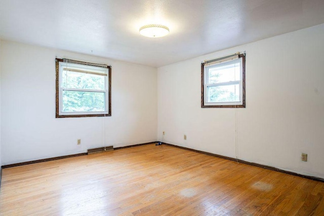 9600 W Debbie Ln, Milwaukee, WI 53224 - empty room with plenty of natural light and light wood-type flooring