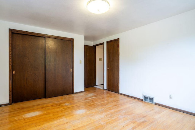 9600 W Debbie Ln, Milwaukee, WI 53224 - unfurnished bedroom featuring light wood-type flooring and a closet