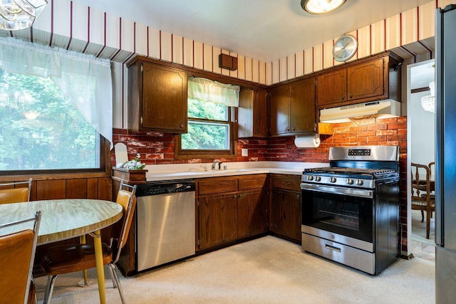 9600 W Debbie Ln, Milwaukee, WI 53224 - kitchen featuring stainless steel appliances, under cabinet range hood, light countertops, and light carpet