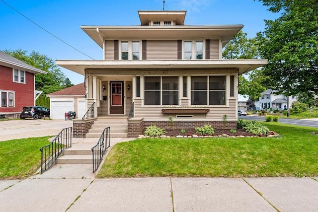 701 N 7th St, Manitowoc, WI 54220 - traditional style home featuring a front yard, a detached garage, a porch, and an outdoor structure