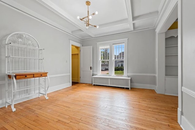 701 N 7th St, Manitowoc, WI 54220 - empty room featuring a chandelier, coffered ceiling, hardwood / wood-style floors, beam ceiling, and radiator heating unit