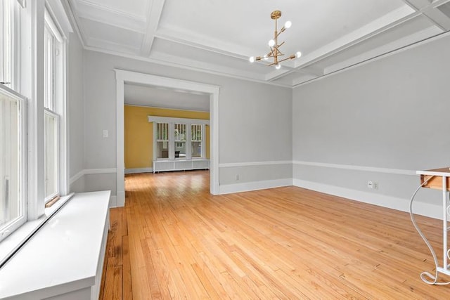 701 N 7th St, Manitowoc, WI 54220 - unfurnished room with coffered ceiling, a chandelier, light wood-type flooring, and beamed ceiling