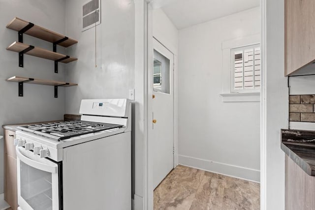 701 N 7th St, Manitowoc, WI 54220 - kitchen featuring gas range gas stove and open shelves