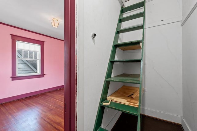 701 N 7th St, Manitowoc, WI 54220 - staircase with wood finished floors and baseboards