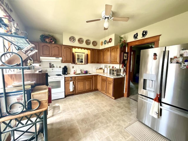 154 W Arndt St, Fond Du Lac, WI 54935 - kitchen with stainless steel refrigerator with ice dispenser, white electric range oven, under cabinet range hood, light countertops, and ceiling fan