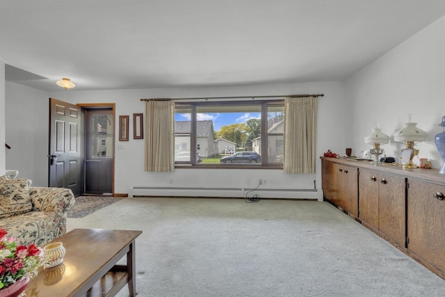 615 Ogden St, Marinette, WI 54143 - living area with a baseboard heating unit and light carpet