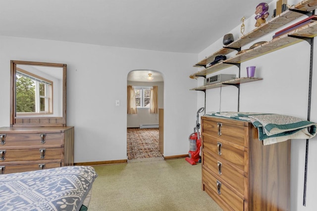 615 Ogden St, Marinette, WI 54143 - bedroom with arched walkways and a baseboard heating unit