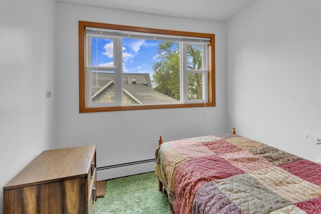 615 Ogden St, Marinette, WI 54143 - carpeted bedroom with a baseboard heating unit