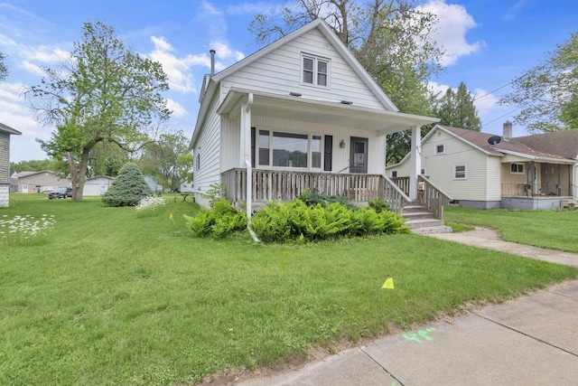 615 Ogden St, Marinette, WI 54143 - view of front of property featuring a porch and a front yard