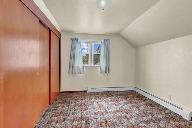 615 Ogden St, Marinette, WI 54143 - bonus room with lofted ceiling, a baseboard radiator, and carpet flooring