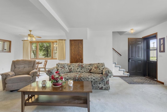 615 Ogden St, Marinette, WI 54143 - carpeted living room with plenty of natural light, stairway, and a ceiling fan