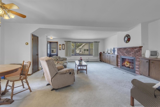 615 Ogden St, Marinette, WI 54143 - living room with carpet flooring, a fireplace, baseboard heating, and a ceiling fan