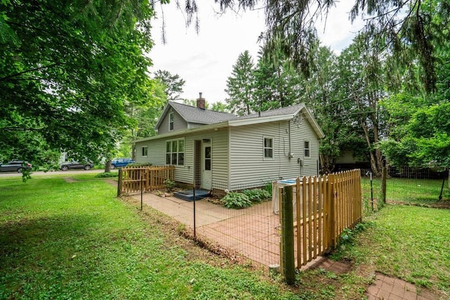 214 E Dell St, New Auburn, WI 54757 - view of home's exterior with a chimney