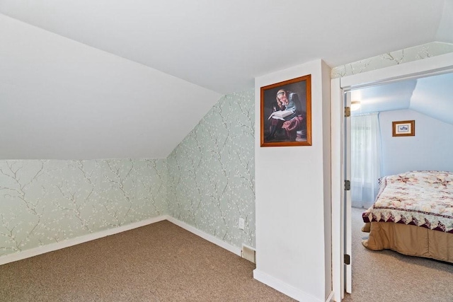 214 E Dell St, New Auburn, WI 54757 - bonus room with vaulted ceiling, carpet, and wallpapered walls